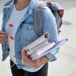 college student holding books
