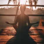 woman relaxing to practice mindfulness and address defense mechanisms