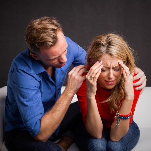 Man Calming woman Down