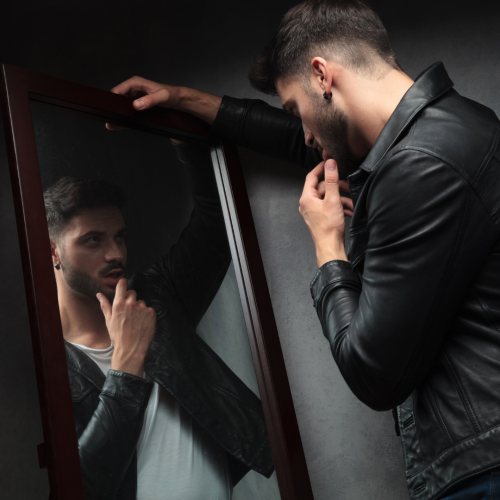 Man looking at the mirror
