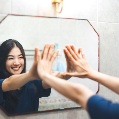 Girl Speaking positively to herself, practicing positive self-talk