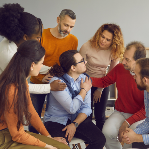 Therapy group supporting a client