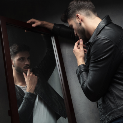 narcissistic man looking in the mirror