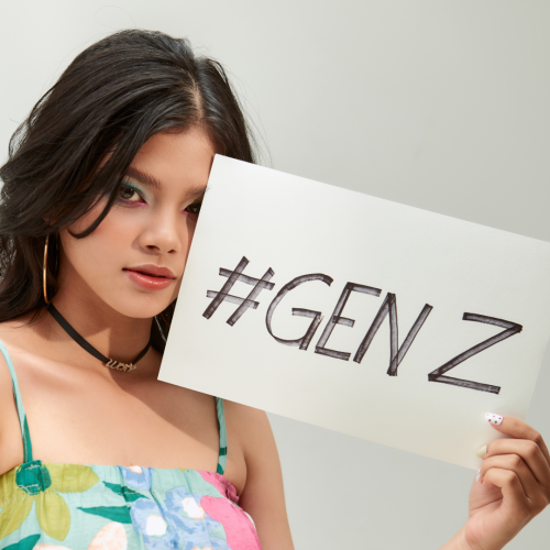 Gen Z woman holding up sign that reads Gen Z.