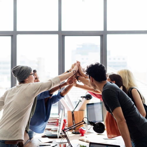 Group of people highfiving