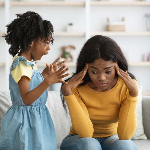 Child yelling at stressed parent