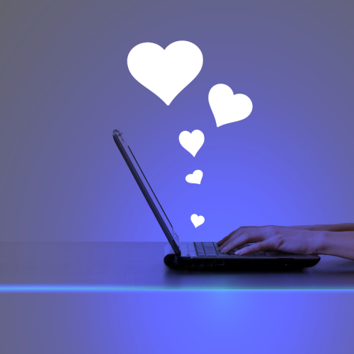 Laptop with hearts coming out from it