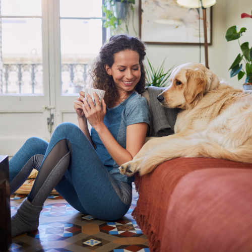 Woman smiling at her dog